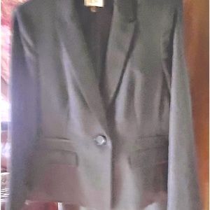 Beautiful grey pants suit. Worn only once. Size 14 P